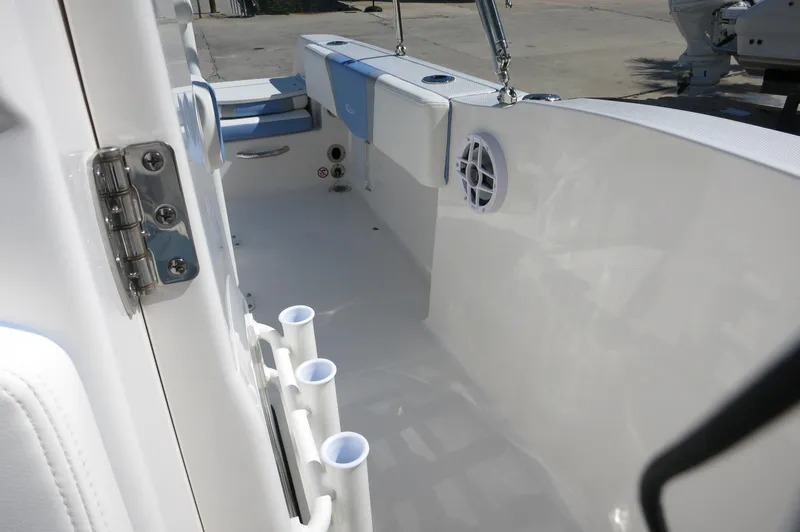 Slide: The Image of 2025 Robalo R180 Center Console boat interior with rod holders and seating. - 27