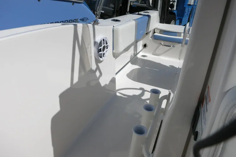 Slide: The Image of 2025 Robalo R180 Center Console boat interior with rod holders and seating. - 28