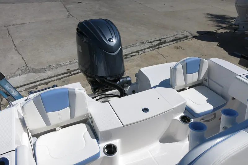 Slide: The Image of 2025 Robalo R180 Center Console boat with dual seating and outboard motor. - 34