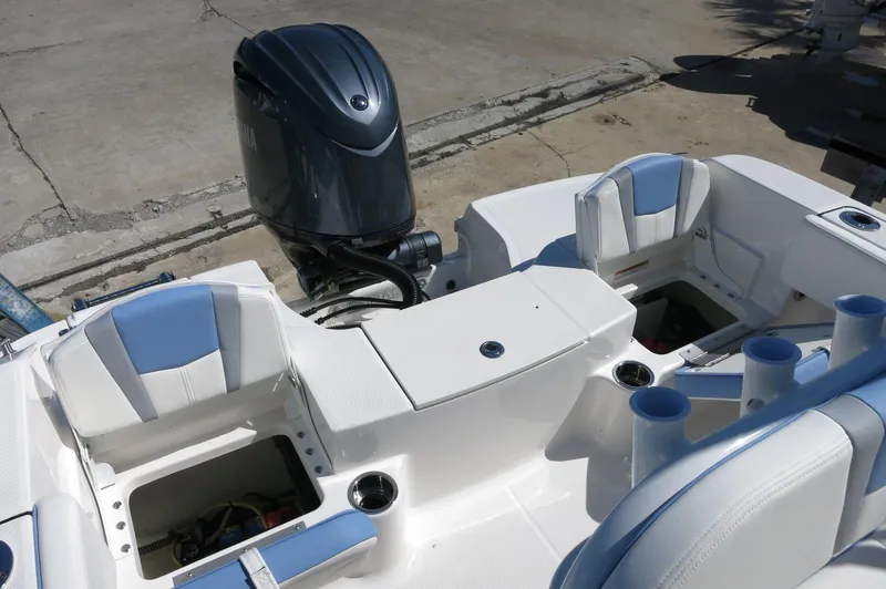 Slide: The Image of 2025 Robalo R180 Center Console boat with outboard motor and seating. - 35