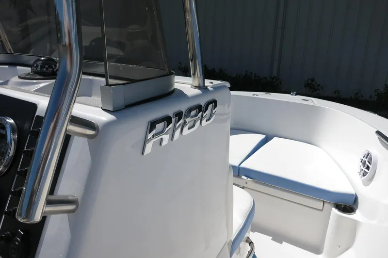 Slide: The Image of 2025 Robalo R180 Center Console boat interior with seating and console details. - 39