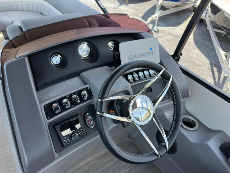 Slide: The Image of Steering console of 2021 Bennington LX 24 Swingback with Garmin navigation system. - 15