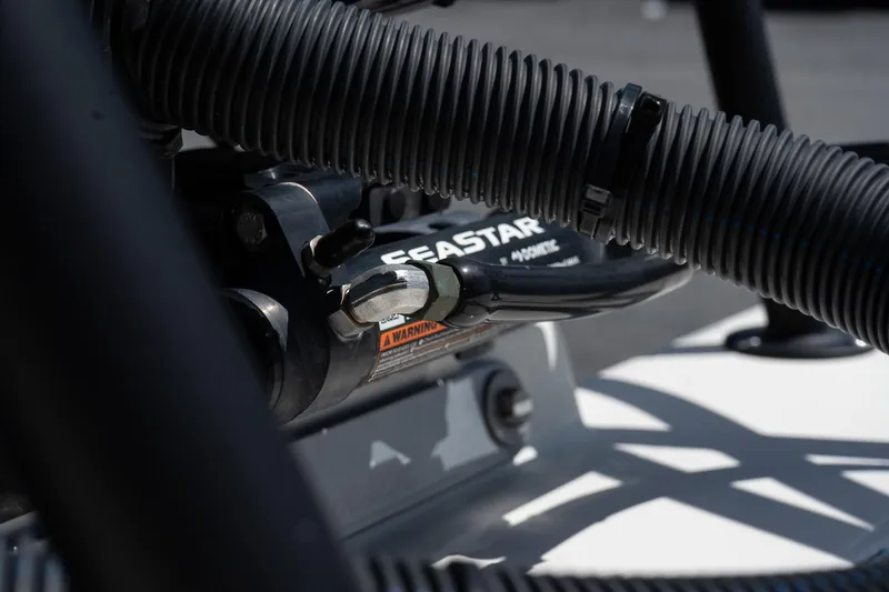 Slide: The Image of Close-up of 2023 Maverick 18 HPX-V boat's SeaStar hydraulic steering system. - 14