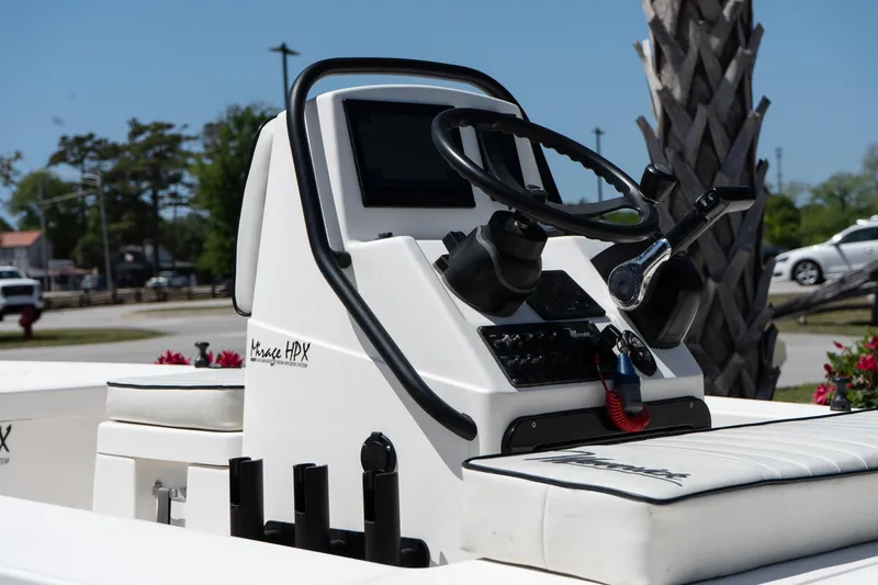 Slide: The Image of 2023 Maverick 18 HPX-V boat console with steering wheel and controls. - 16