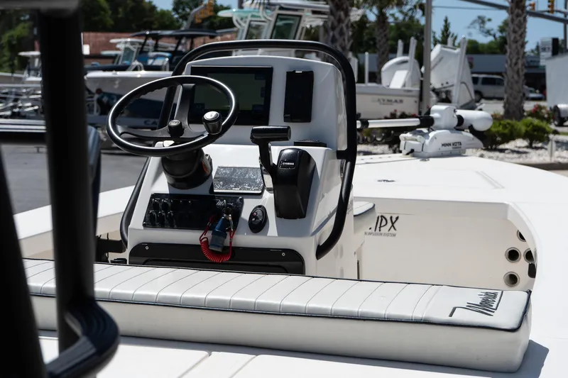 Slide: The Image of 2023 Maverick 18 HPX-V boat console with steering wheel and controls. - 17