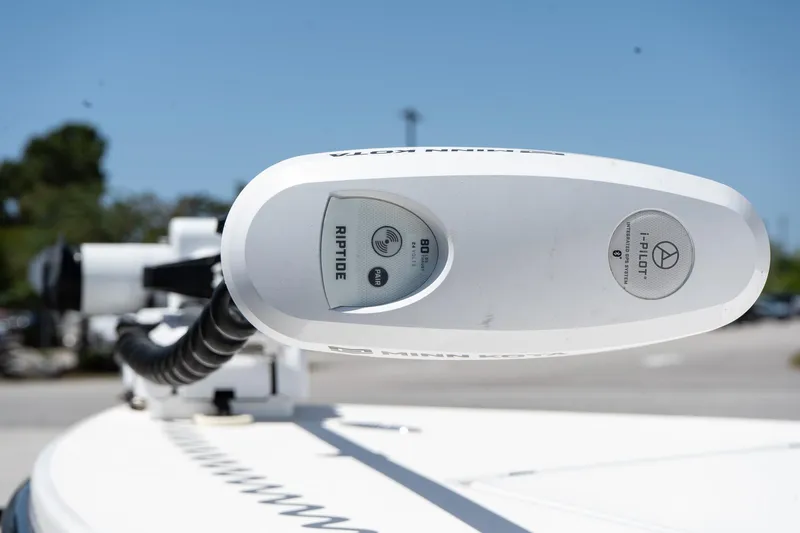 Slide: The Image of Close-up of a 2023 Maverick 18 HPX-V boat's trolling motor, featuring Riptide branding. - 19