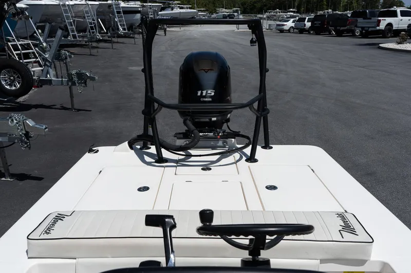 Slide: The Image of 2023 Maverick 18 HPX-V boat with Yamaha 115 engine, parked in a marina. - 20