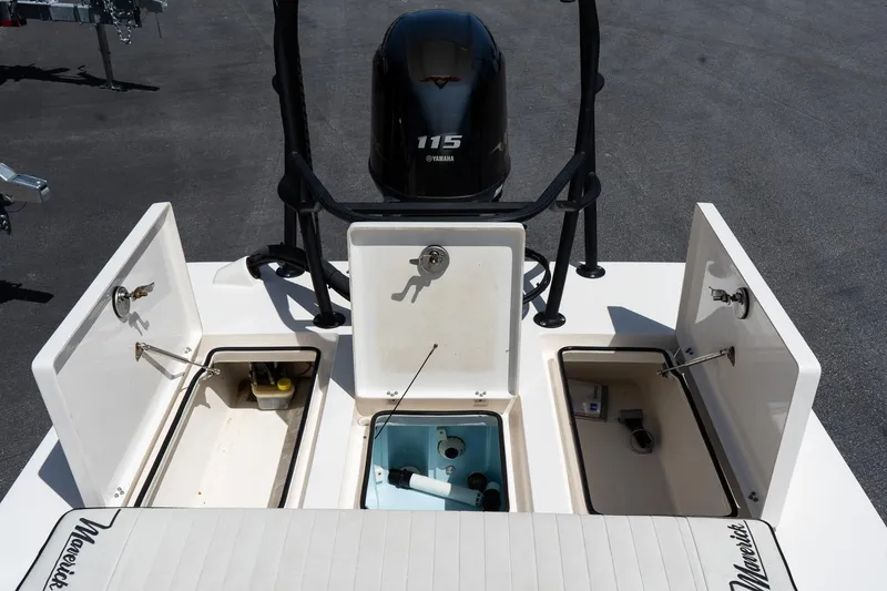 Slide: The Image of 2023 Maverick 18 HPX-V boat with open storage compartments and Yamaha 115 engine. - 21