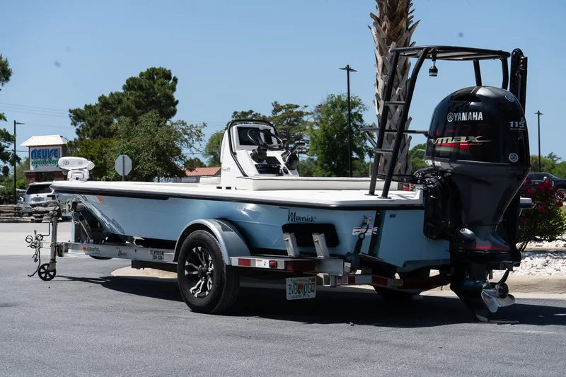 Slide: The Image of 2023 Maverick 18 HPX-V boat on trailer with Yamaha outboard motor, parked outdoors. - 9