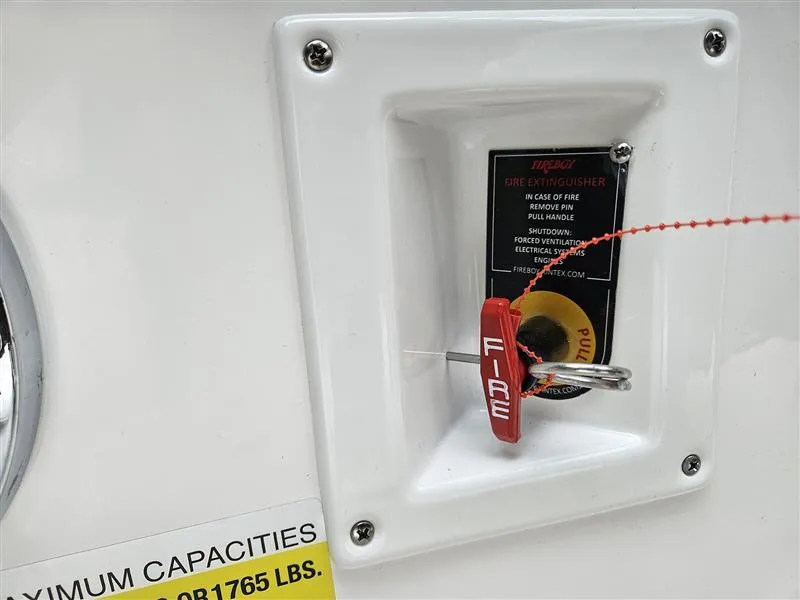 Slide: The Image of Fire extinguisher pull handle on 2025 Chaparral 247 SSX boat. - 33