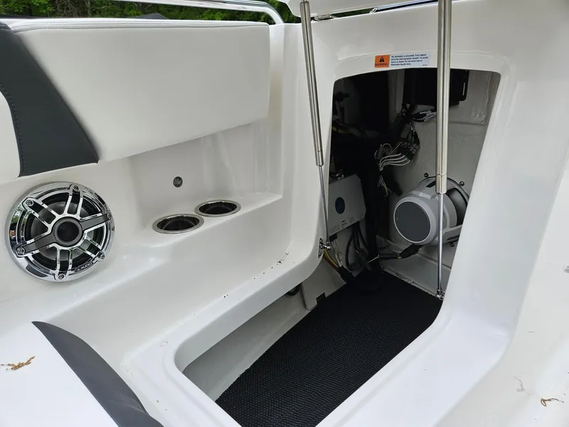 Slide: The Image of 2025 Chaparral 247 SSX boat interior with speaker and storage compartment. - 42