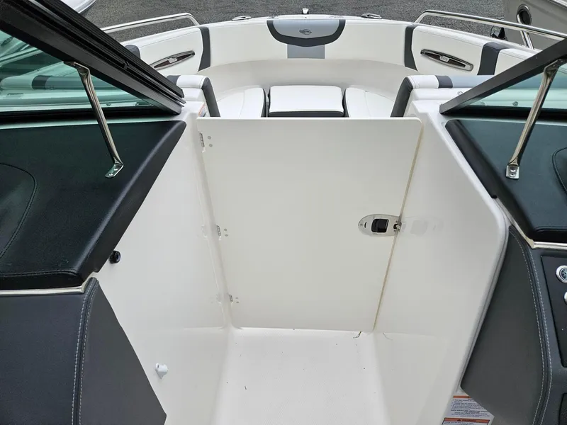 Slide: The Image of 2025 Chaparral 247 SSX boat interior with open bow access and seating area. - 46