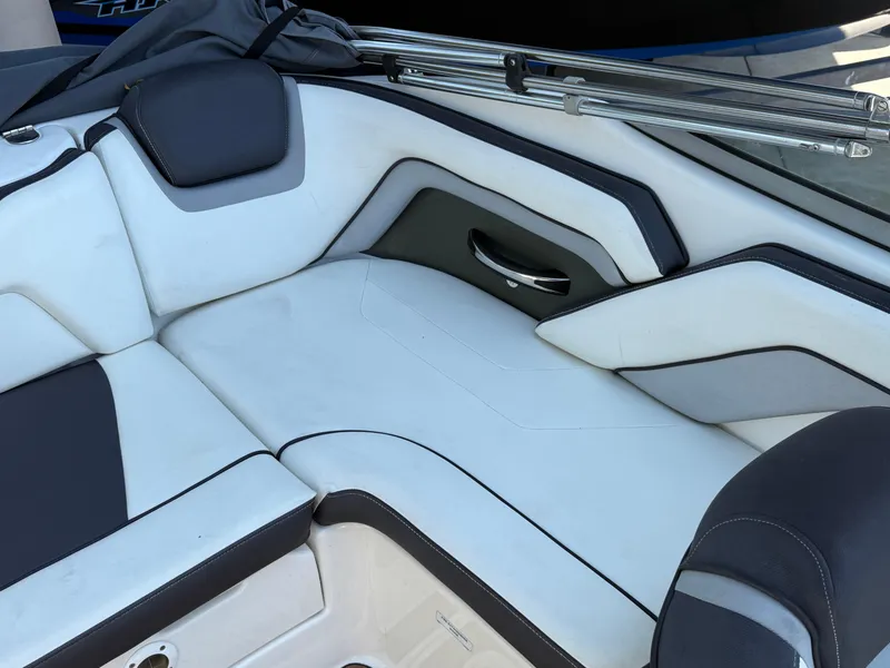 Slide: The Image of 2015 Yamaha Boats SX192 interior seating with white and black upholstery. - 10