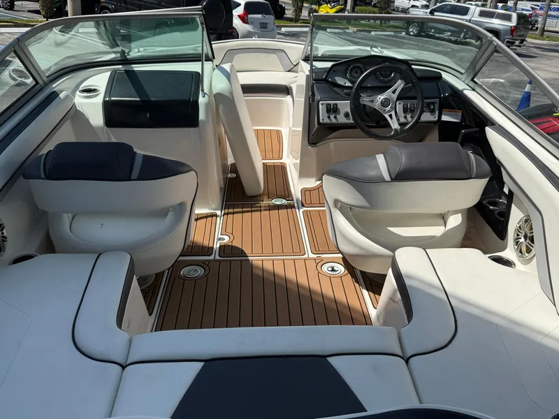Slide: The Image of 2015 Yamaha Boats SX192 interior with sleek design and comfortable seating. - 13