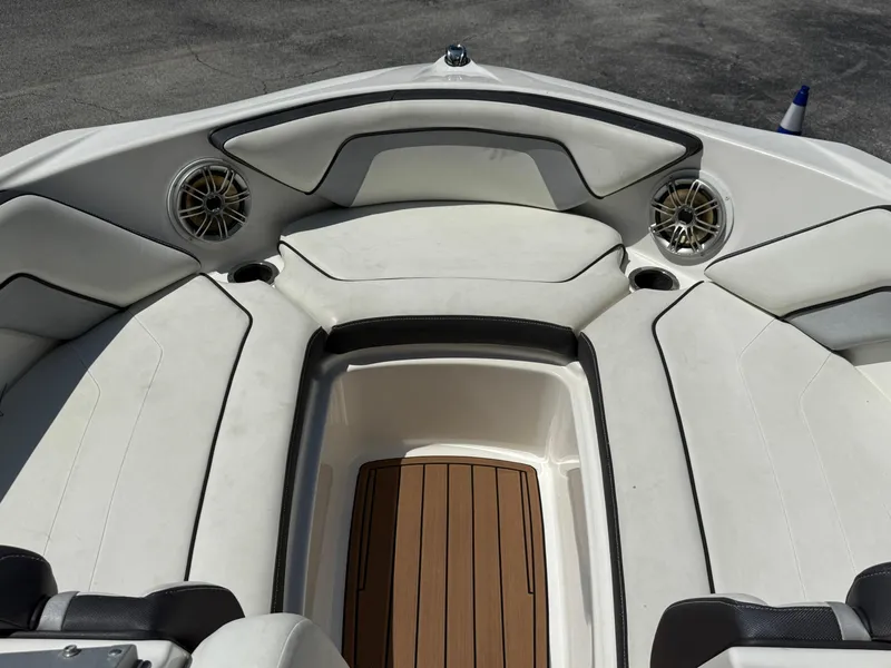 Slide: The Image of 2015 Yamaha Boats SX192 interior with cushioned seating and wood-style flooring. - 8