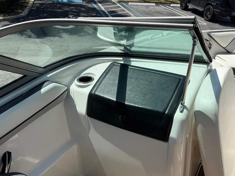 Slide: The Image of 2015 Yamaha Boats SX192 interior with windshield and storage compartment. - 9