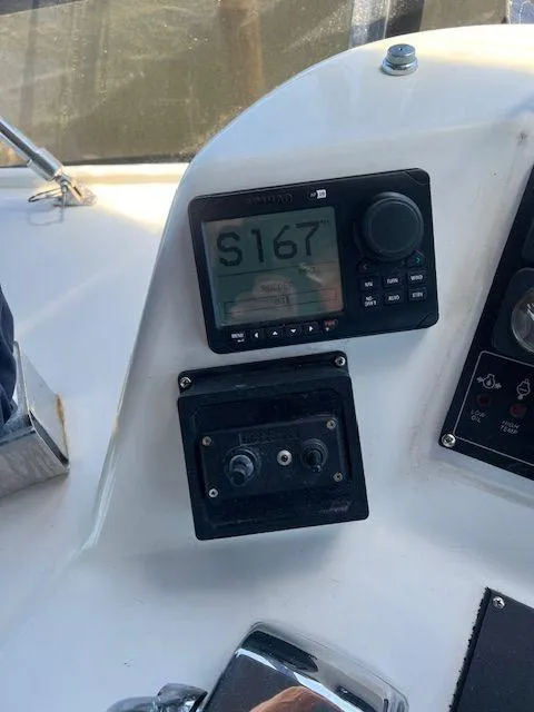 Slide: The Image of Control panel of a 1990 Jefferson 42 Viscount Sundeck boat with navigation equipment. - 22