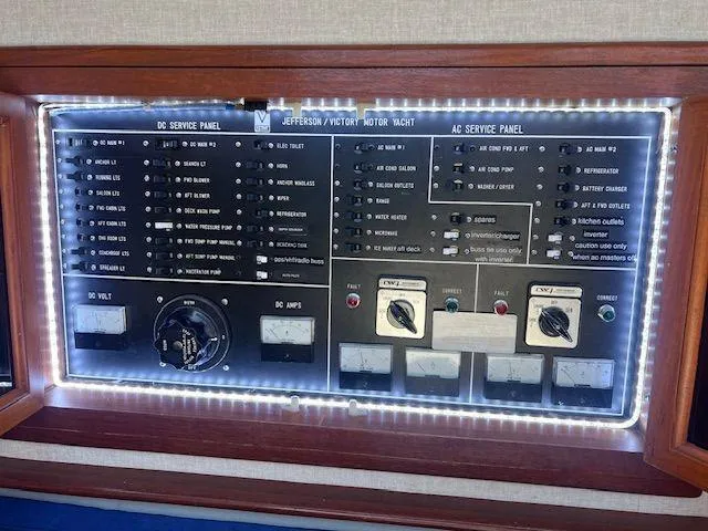 Slide: The Image of Control panel of 1990 Jefferson 42 Viscount Sundeck motor yacht, illuminated with LED lights. - 42