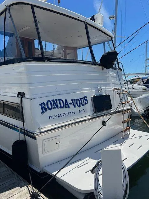 Slide: The Image of 1990 Jefferson 42 Viscount Sundeck yacht docked in Plymouth, MA, named "Ronda-Vous". - 5