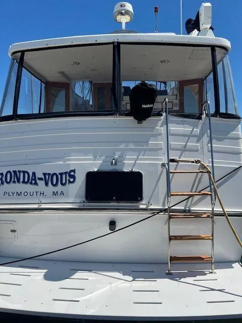 Slide: The Image of 1990 Jefferson 42 Viscount Sundeck yacht with ladder, docked in Plymouth, MA. - 6