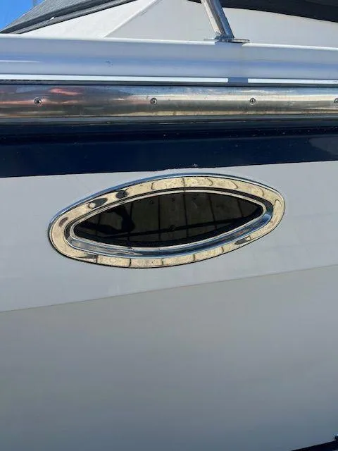 Slide: The Image of 1990 Jefferson 42 Viscount Sundeck boat with oval porthole detail. - 9