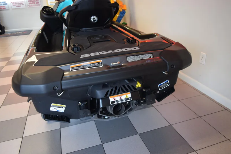 Slide: The Image of 2024 Sea-Doo GTR 230 jet ski rear view on tiled showroom floor. - 4