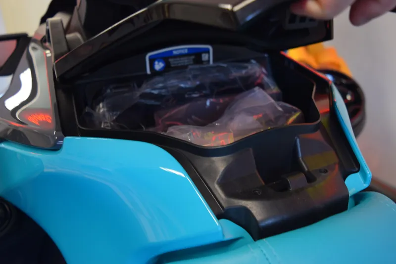 Slide: The Image of 2024 Sea-Doo GTR 230 storage compartment open, showcasing interior space. - 7