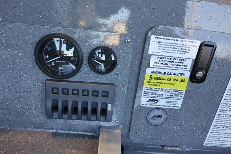 Slide: The Image of Control panel of 2025 Thunder Jet 209 Rush OT boat with gauges and capacity label. - 11