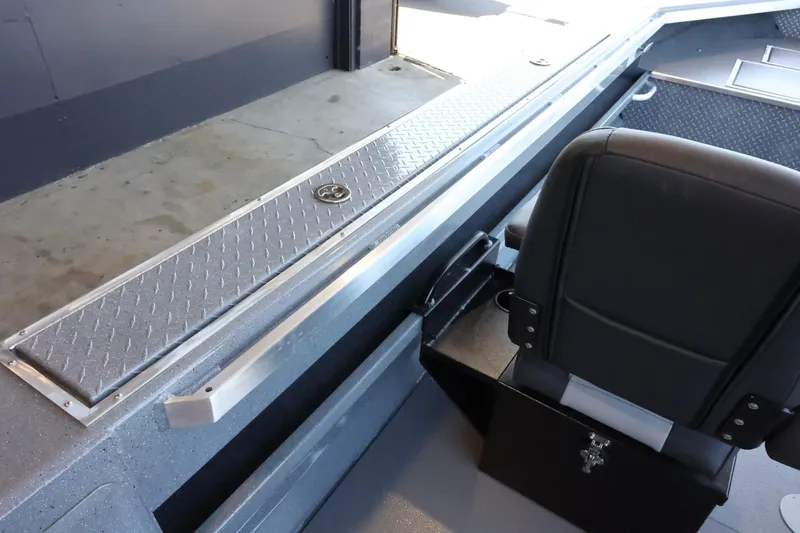 Slide: The Image of Interior view of 2025 Thunder Jet 209 Rush OT boat, featuring seating and storage. - 15