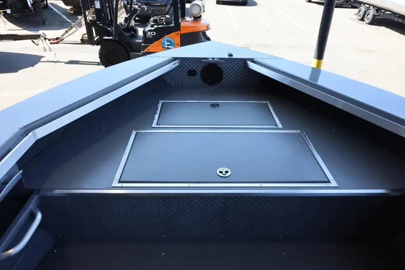 Slide: The Image of 2025 Thunder Jet 209 Rush OT boat interior with storage compartments. - 17