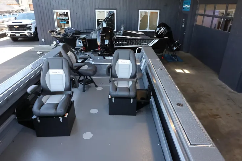 Slide: The Image of 2025 Thunder Jet 209 Rush OT boat interior with seating and controls. - 21