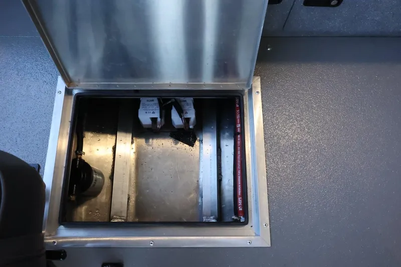 Slide: The Image of 2025 Thunder Jet 209 Rush OT boat storage compartment with open hatch. - 24
