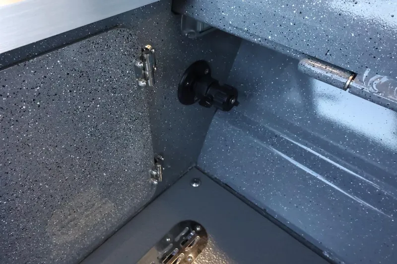 Slide: The Image of Interior detail of 2025 Thunder Jet 209 Rush OT boat, showcasing storage compartment. - 26