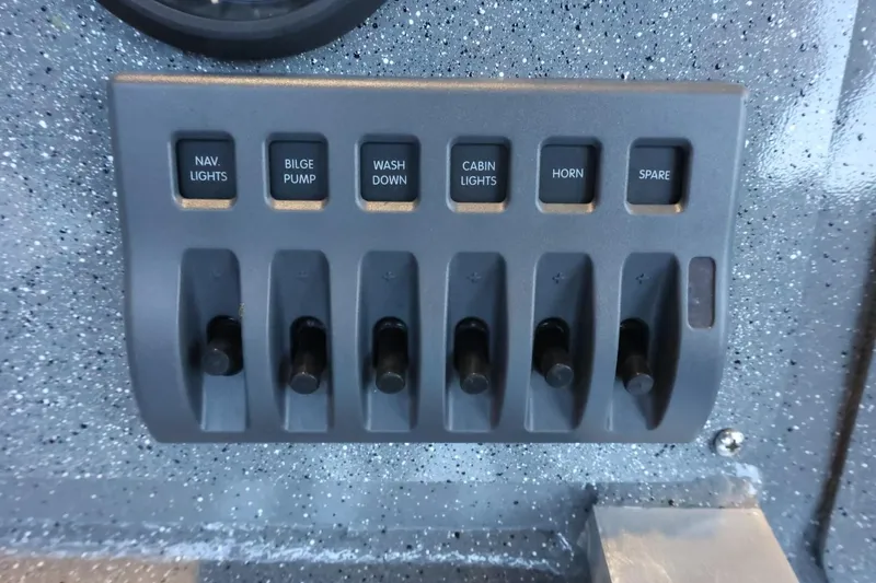 Slide: The Image of Control panel of 2025 Thunder Jet 209 Rush OT boat with labeled switches. - 33