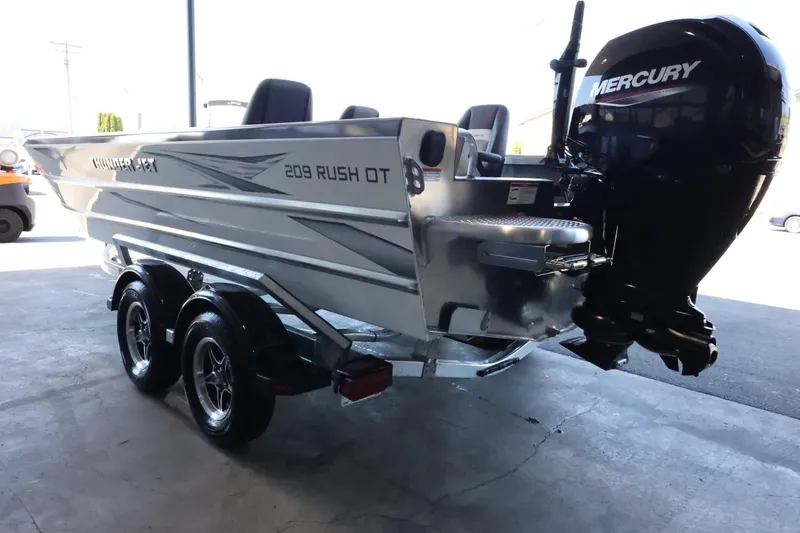Slide: The Image of 2025 Thunder Jet 209 Rush OT boat with Mercury engine on trailer. - 7