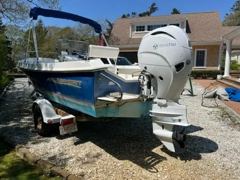 Slide: The Image of 2001 Aquasport 200 Osprey boat with Tohatsu outboard motor on a trailer. - 2