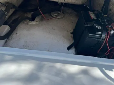 Slide: The Image of Battery compartment of a 2001 Aquasport 200 Osprey boat with visible wiring. - 9