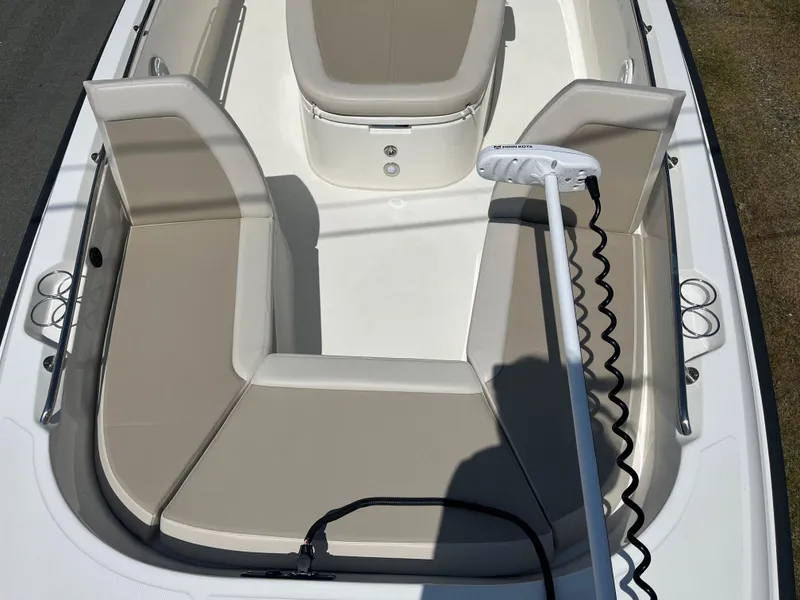 Slide: The Image of 2022 Boston Whaler 270 Dauntless boat interior with beige seating and trolling motor. - 11