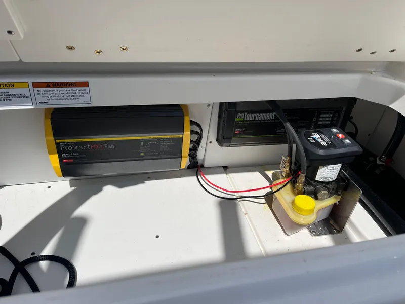 Slide: The Image of Electrical components inside a 2022 Boston Whaler 270 Dauntless boat compartment. - 21