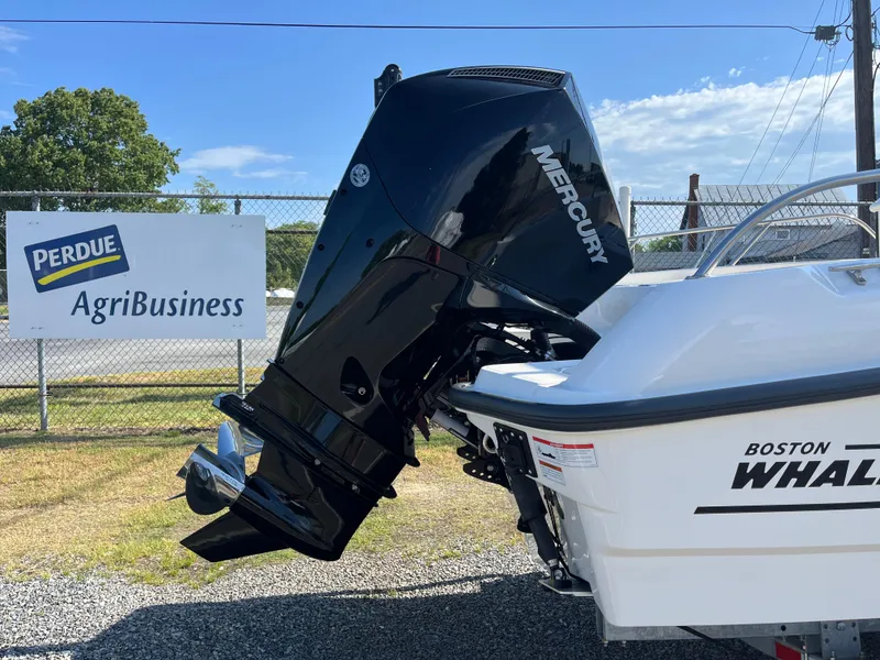 Slide: The Image of 2022 Boston Whaler 270 Dauntless with Mercury engine, parked near Perdue AgriBusiness sign. - 27