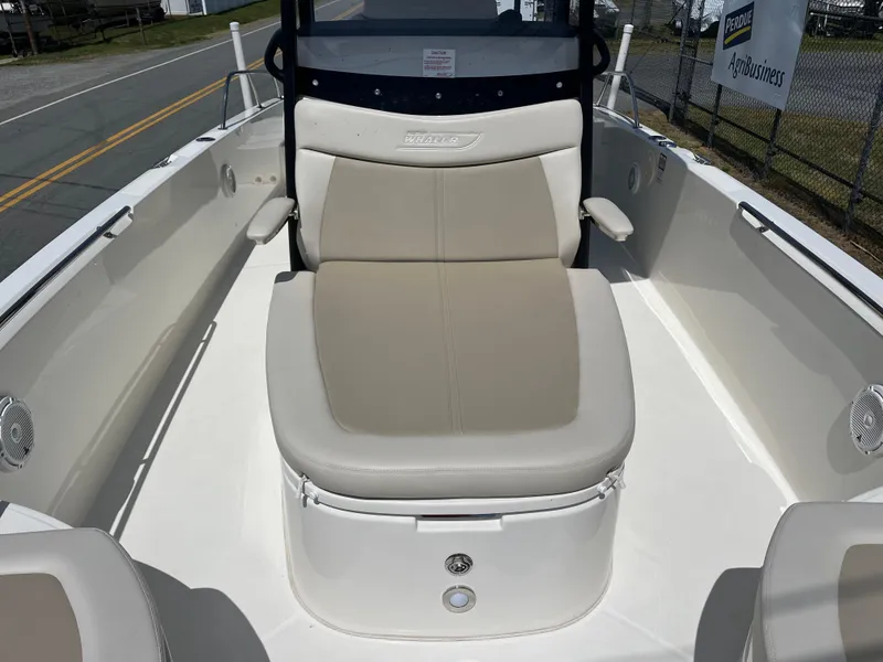 Slide: The Image of 2022 Boston Whaler 270 Dauntless boat interior with beige seating and sleek design. - 9