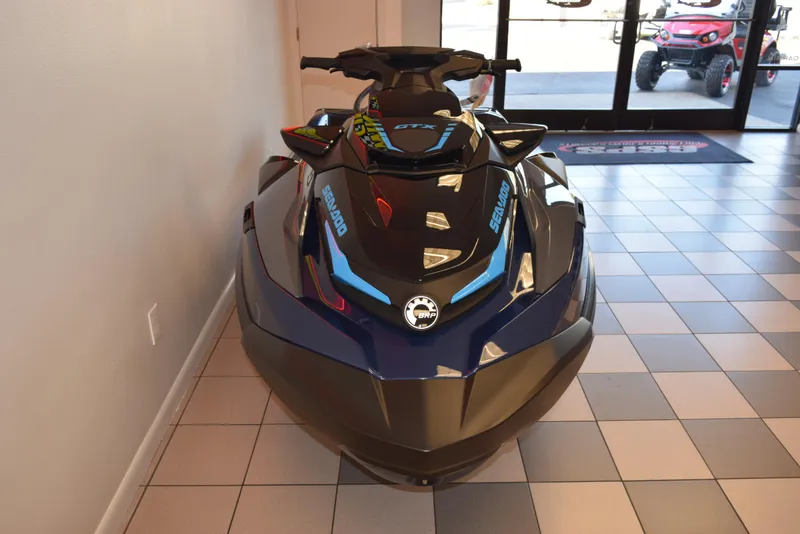 Slide: The Image of 2024 Sea-Doo GTX 230 jet ski displayed indoors on tiled floor. - 3