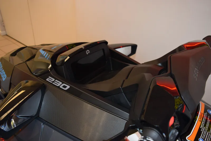 Slide: The Image of 2024 Sea-Doo GTX 230 jet ski, sleek black design, rear view. - 7