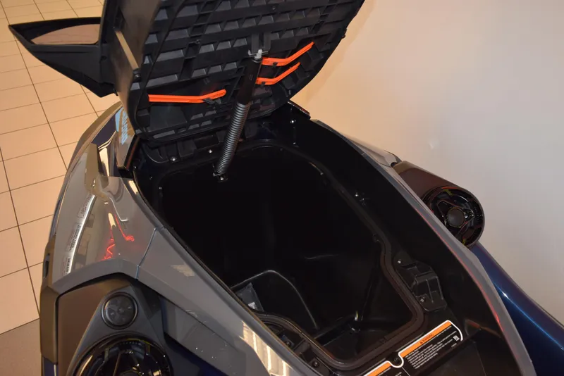 Slide: The Image of 2024 Sea-Doo GTX 230 storage compartment open, showcasing spacious interior design. - 9