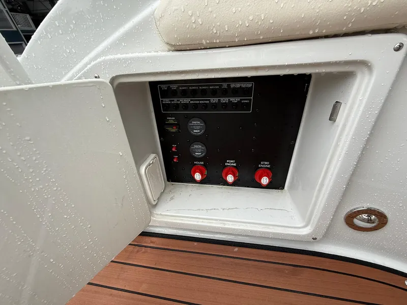 Slide: The Image of Control panel of a 2019 Crownline 350 SY boat, featuring switches and gauges. - 15