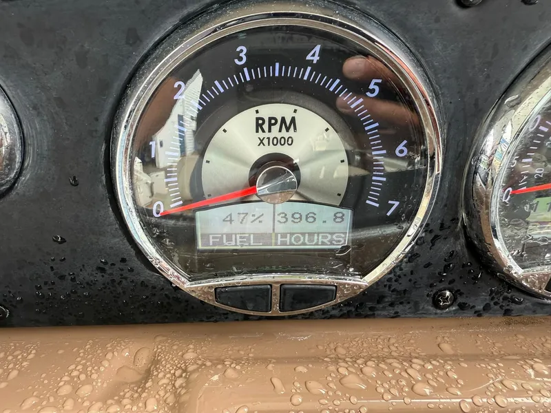 Slide: The Image of Close-up of a 2019 Crownline 350 SY RPM gauge, showing 477.3 hours. - 25