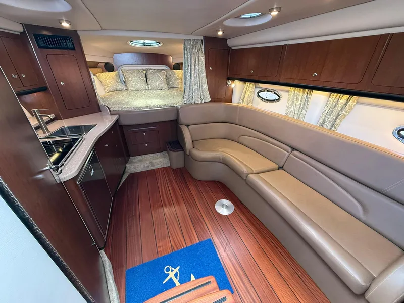 Slide: The Image of Luxurious interior of 2019 Crownline 350 SY yacht with elegant seating and kitchenette. - 29