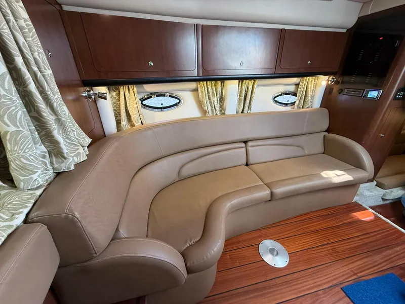 Slide: The Image of Luxurious interior of 2019 Crownline 350 SY yacht with elegant leather seating and wood accents. - 31