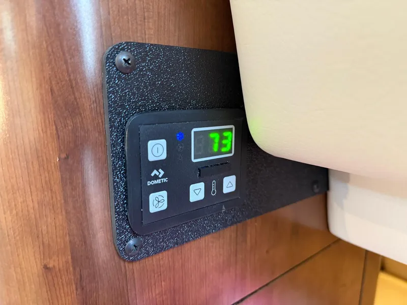 Slide: The Image of Digital thermostat display on 2019 Crownline 350 SY boat, showing temperature at 73 degrees. - 34