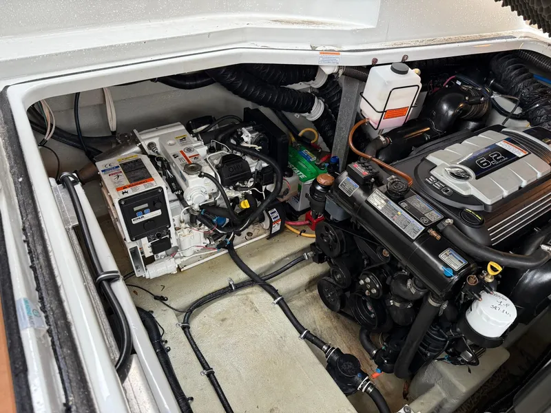 Slide: The Image of Engine compartment of a 2019 Crownline 350 SY boat, showcasing mechanical components and systems. - 43